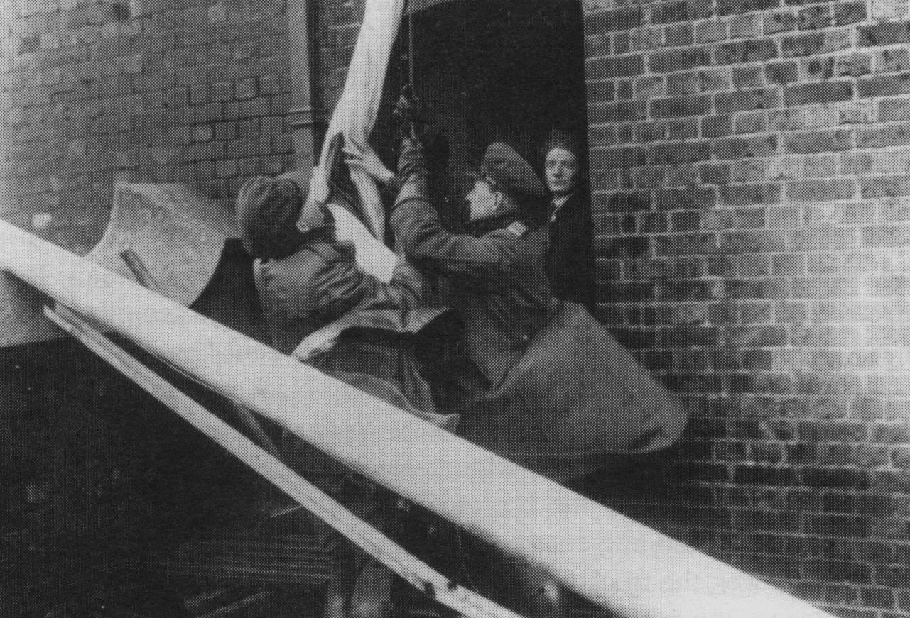 The Tricolour is raised on the Water Tower at 12 O'Clock, noon, 16th May 1922