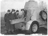 Crew of a Ford Armoured Car load up.
